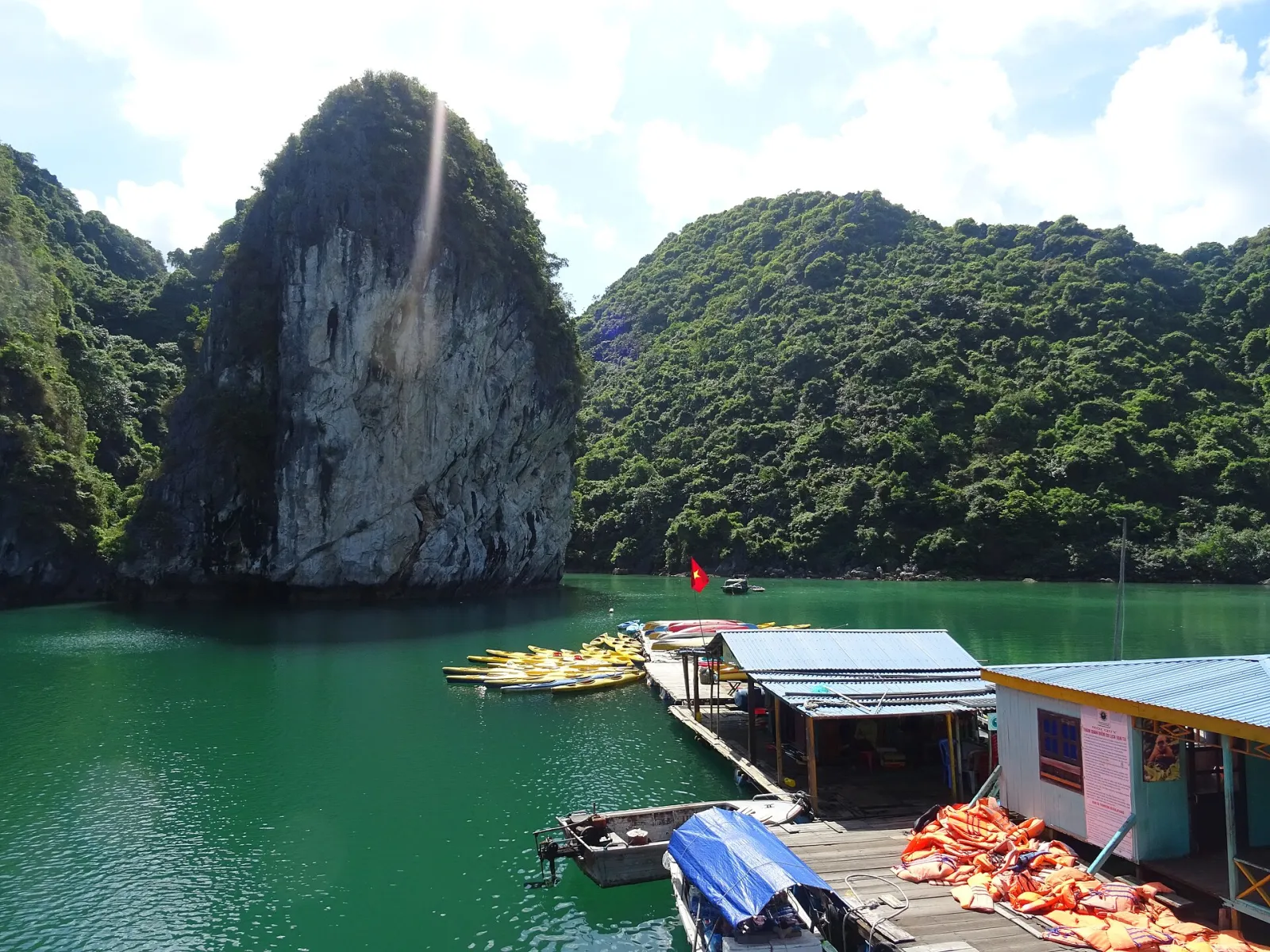 Kayaks beside limestone islands in Ha Long Bay