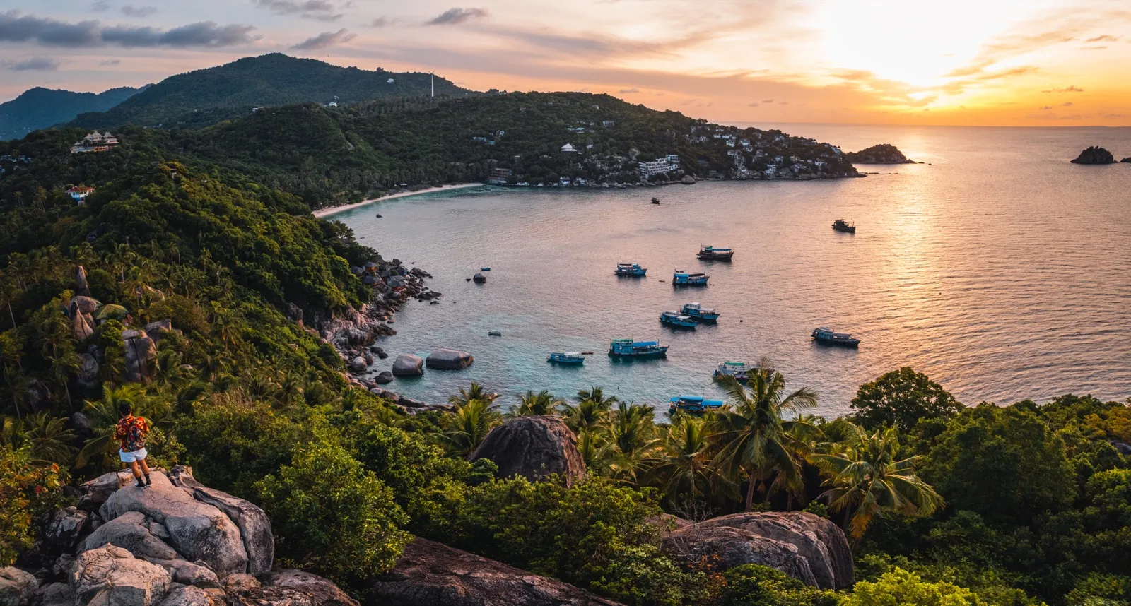 Tropical bay with small boats at sunset in southern Vietnam