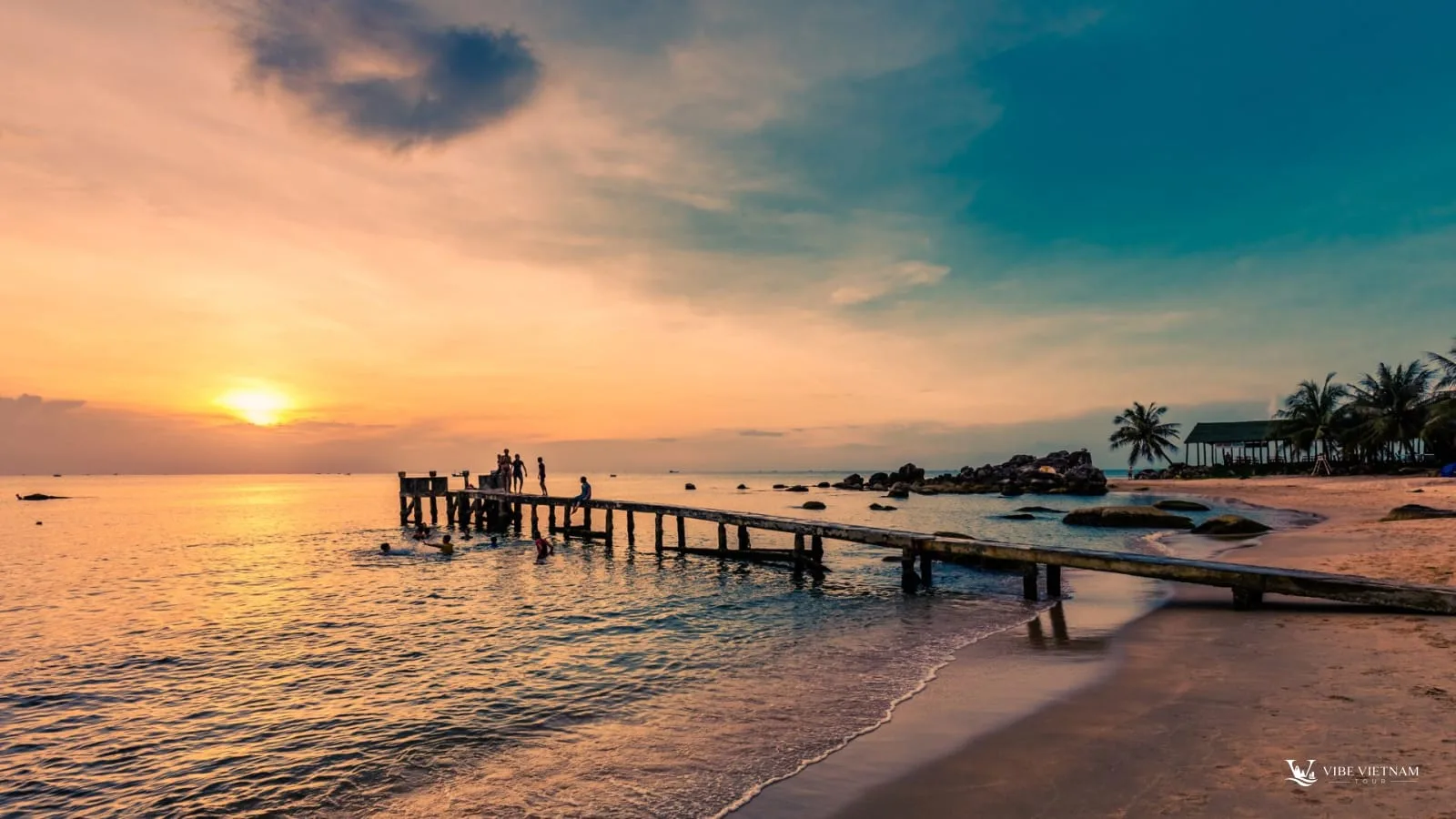 Sunset over a wooden jetty on Long Beach, Phu Quoc