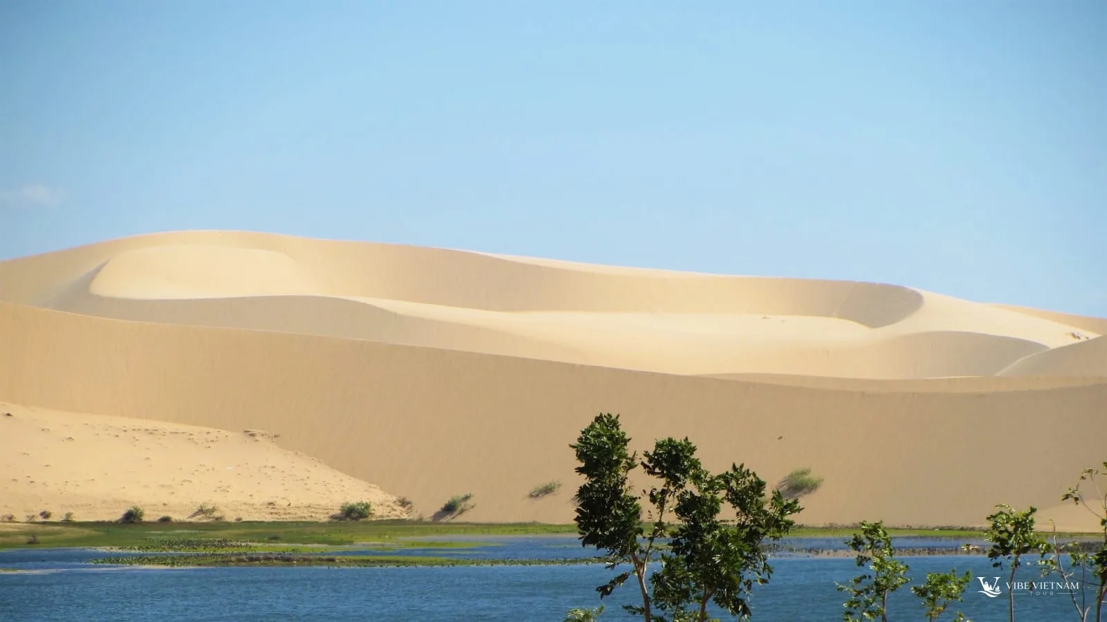 White sand dunes beside a lake near Mui Ne